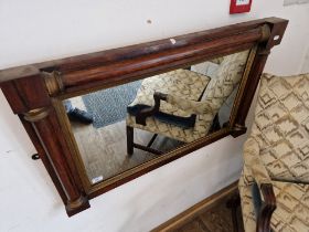 A Regency rosewood and parcel gilt overmantle mirror with split column supports, 89cm x 54cm.