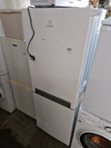 A Panasonic microwave & an Indesit fridge freezer