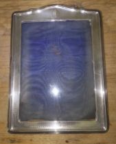 A hallmarked silver photograph frame 20cm x 27cm.