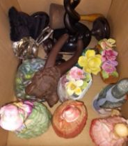 A box of various ceramic figures, nutcracker, marbles, candlestick holders, etc.