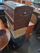 Four vintage trunks to include wooden, tin, etc.