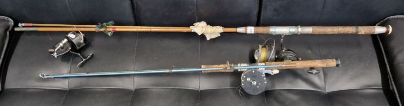 Two sea fishing rods with reels together with one other reel.