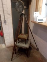 A vintage lamp on tripod base.