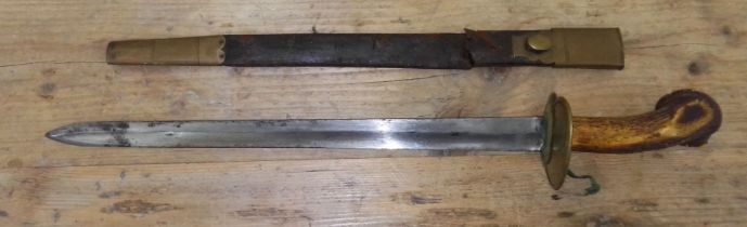 A 19th century antler handled short sword, single edged and fullered blade, length 40.5cm, brass