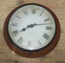 An oak round electric wall clock, diameter 38cm.