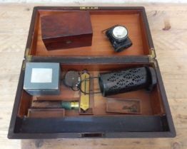 A rosewood writing slope with campaign inset handles (as found) containing various collectables; tea