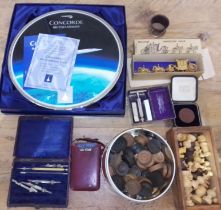 A box of assorted collectables including a Bradford Exchange Concorde plate, miniature Coronation
