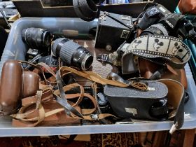 A box of assorted cameras, lenses, binoculars & accessories to include a Kodak Brownie C....