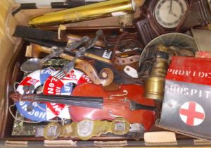 A box of assorted collectables including a charity box, violin parts, a kaleidoscope, female nude