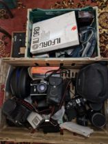 Two boxes of assorted cameras, accessories and a pair of headphones to include Pentax....