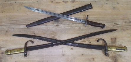 Three bayonets comprising two French sword bayonets and a WWI Remmington bayonet and scabbard,