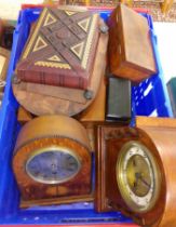 A box of assorted items including two clocks, cutlery sets etc.