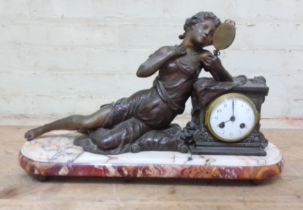 A figural mantle clock, spelter figure, marble base, length 54cm.