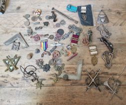 A tin of various military badges / pins, WW2 Star medal, Masonic ware, few toys, etc.