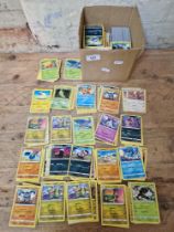 A box of approximately 1200-1500 Pokemon cards.