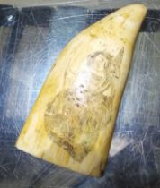 A 19th century sailor's whale tooth scrimshaw, the carving depicting a lady wearing a dress with one