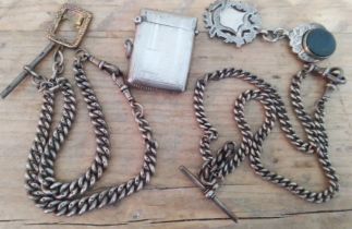 Two silver Albert chains, a hallmarked silver vesta and two fobs.