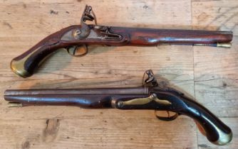 A pair of reproduction flintlock pistols, 31cm barrel with ramrod below, touch hole is just an...