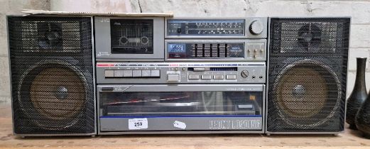 A vintage JVC portable stereo disc center, DC-33L.