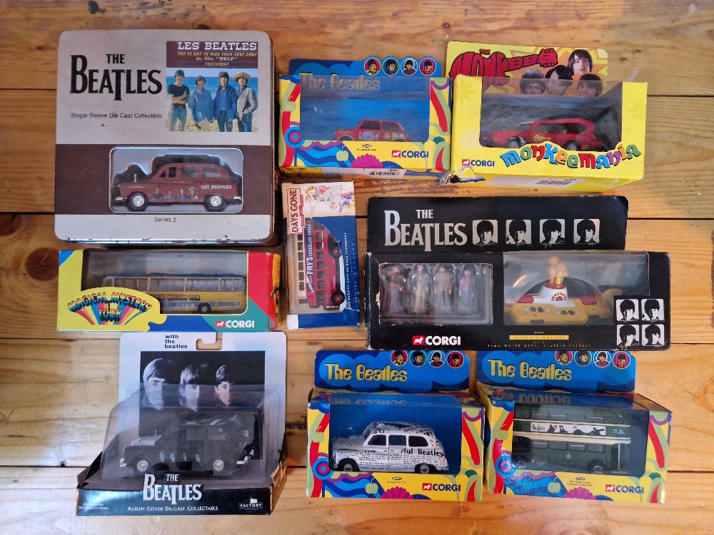 A box of assorted boxed Corgi Beatles vehicles to include Psychedelic Mini & yellow submarine etc.