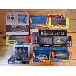 A box of assorted boxed Corgi Beatles vehicles to include Psychedelic Mini & yellow submarine etc.