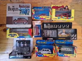 A box of assorted boxed Corgi Beatles vehicles to include Psychedelic Mini & yellow submarine etc.