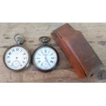 Two oversized pocket watches and a vintage Omega watch box.