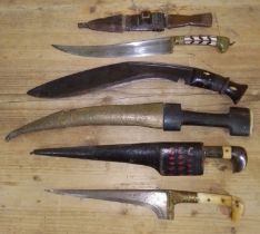 A group of six African and eastern daggers.