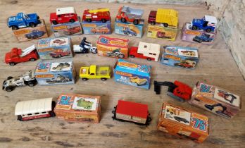 A group of fourteen assorted Matchbox 75 Series diecast model vehicles, with boxes.