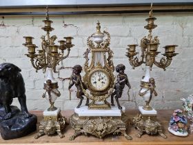 A reproduction clock garniture, tallest measurement 69cm.