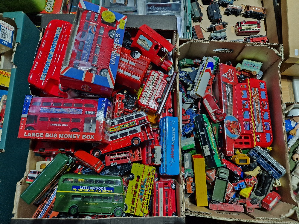 Two boxes of assorted die cast model buses & London bus related items to include Corgi, Dinky,