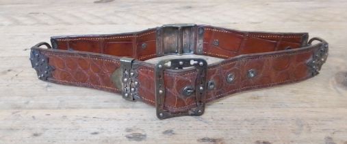 A Victorian silver mounted crocodile leather belt, Willaim Henry Dee, London 1878. Approx. 69cm