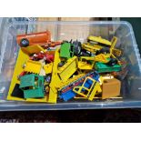 A Box of Britains die cast agricultural vehicles, accessories and figures.