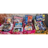 Four boxes of assorted games, Lego, construction sets.