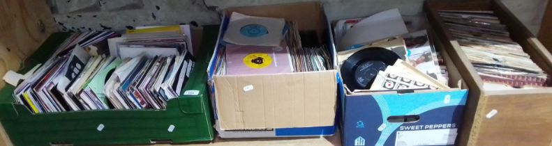 Four boxes of assorted 45s.