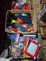 Two boxes of assorted toys to include Scalextic, Star wars, an Etch A Sketch & a childrens ty...