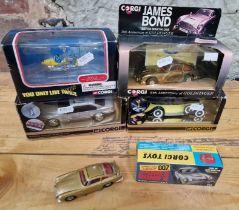 Five Corgi James Bond die cast model vehicles, all boxed.