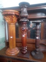 Three carved wood pedestals