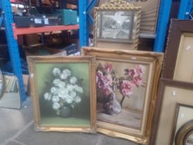 Two gilt framed mirrors together with two still life oil paintings of flowers, one signed 'Suzanne',
