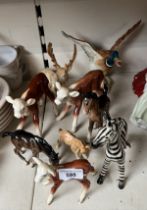 9 Beswick animal figures including cattle, horse, stag, duck in flight, together with a ceramic