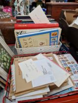 A box of stamp books and albums and a tray of assorted covers.
