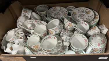 A box of Minton 'Haddon Hall' ceramics including teapot, cups, saucers, etc.