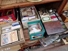 Four boxes of vintage playing cards, etc.