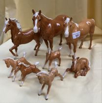 A group of 10 Palomino horse figures by Beswick. Various sizes ranging from 21cm tall to appx 8cm