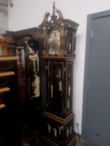 A Chinese black lacquer and gilt decorated eight day long case clock with weights and pendulum.