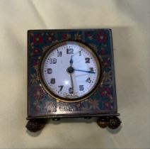 A small Cloissonne carriage clock.
