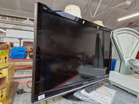 A 37" Panasonic Viera TV with remote and instructions.