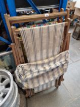 Two canvas deck chairs and one vintage deck chair complete with sun shade and foot rest.