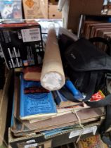 A box of books, vintage Bartholomew's canvas maps, movie and music posters to include Led