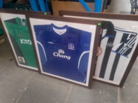 A framed Newcastle United home shirt by Adidas season 1999-2000(unsigned).